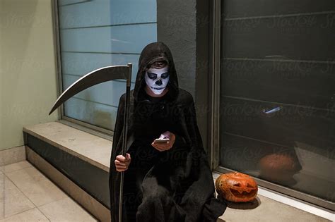 Woman In Halloween Costume Using The Phone By Stocksy Contributor Aleksandra Jankovic Stocksy