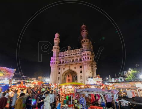 Image Of Bazaar Street Crowd Alongside The Charminar During The Night