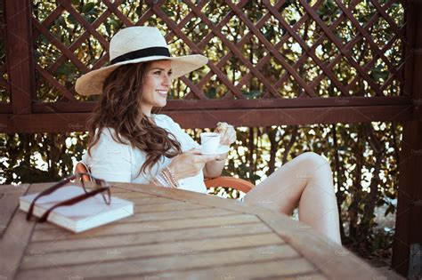 Relaxed Stylish Woman In White Shirt Sitting At Table People Images