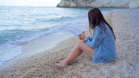 Young woman reading on tropical white beach 20056607 Stock Video at ...