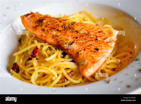 grilled salmon  aglio olio spaghetti  herb stock photo alamy