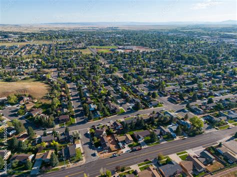 Neighborhood aerial drone picture of cityscape and town with houses and ...