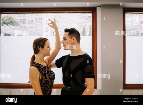 Slender Graceful Couple Performing Ballroom Dance While Rehearsing In