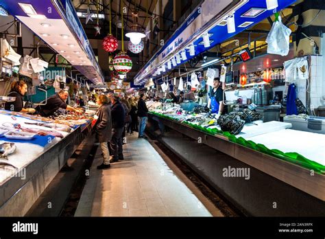 People Shopping At The Fish Market Stalls In Mercat De L Olivar Palma