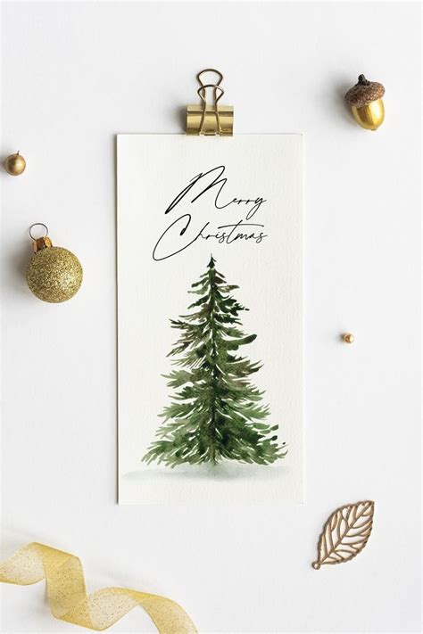 A Christmas Card With A Watercolor Pine Tree On It Surrounded By Gold