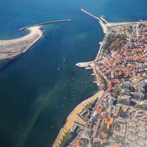 An Aerial View Of A City And The Ocean