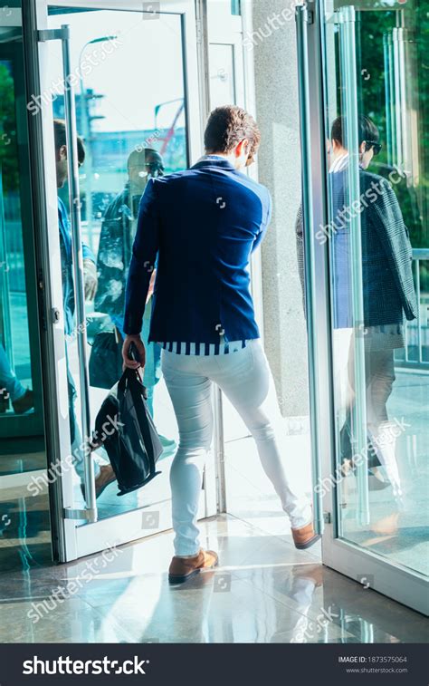 Handsome Businessman Leaving Office Building Glass Stock Photo