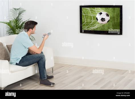 Man Watching Football Match On Television Stock Photo Alamy