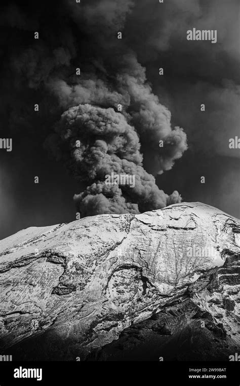 A Scenic View Of An Erupting Volcano In Grayscale Stock Photo Alamy