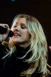 Ellie Goulding Wavy Platinum Blonde Chin Length Layers Dark Roots