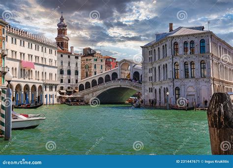 Traditional Gondola Near World Famous Canal Grande And Rialto Bridge