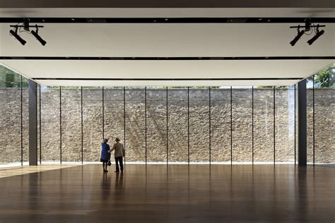 The Glass Walled Pavilion Gives Visitors Dramatic Views Of An Historic Stone Wall Museum