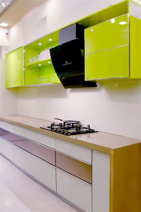 Pastel Green Modular Kitchen with Striking Black Chimney