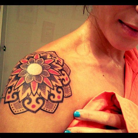 Flower tattoo on shoulder