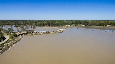 Aerial Photos Show Flood Aftermath Following Dam Failure