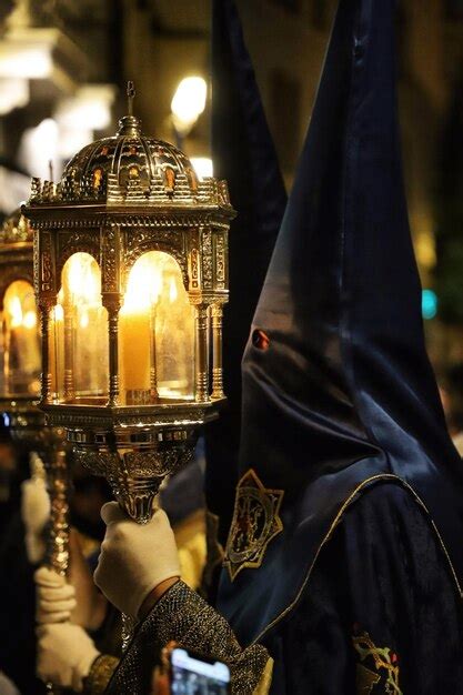 Premium Photo A Man Holds A Lantern With The Number On It