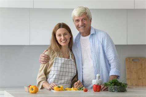 Cheerful Daughter And Mature Elder Father Enjoying Cooking Stock Photo Image Of Embrace Elder