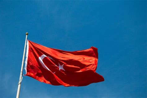 Premium Photo Turkish National Flag With White Star And Moon In Sky