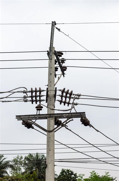 Premium Photo | Electricity transmission pole with wires close up shot in the urban area