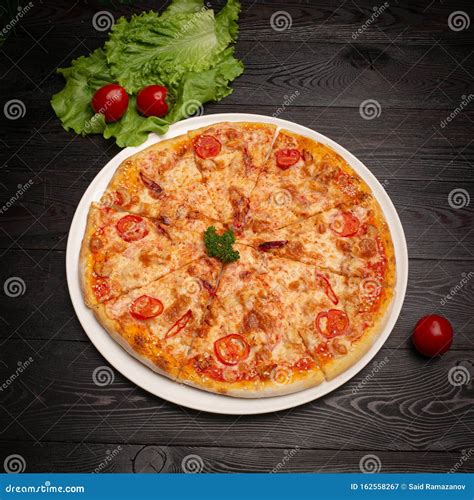 Assorted Pizza Sliced into Pieces with Cheese, Tomato and Olives Stock ...