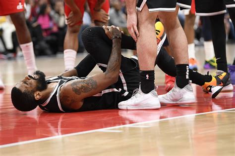 Kyrie Irving Injures Knee As Wizards Top Nets The Boston Globe