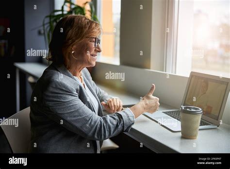 Positive Delighted Mature Woman Communicating Per Video Stock Photo Alamy