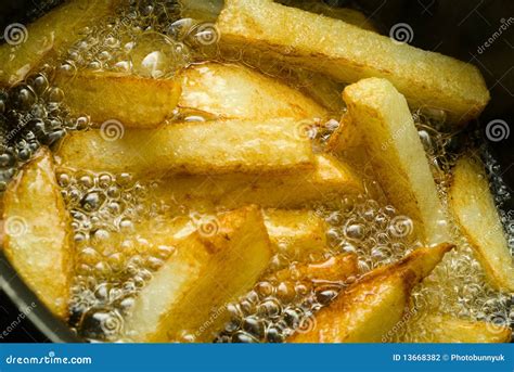 Chips Cooking In Oil Stock Photo Image Of Saturated 13668382