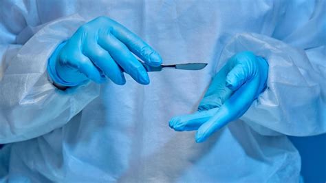 Premium Photo | Scalpel in the hands of a surgeon