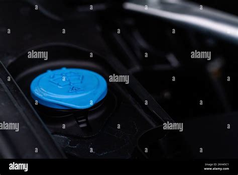 Closeup Blue Windshield Washer Fluid Reservoir Cap In Engine Room