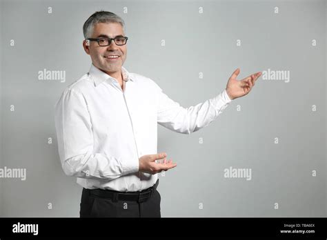 Mature Male Teacher On Grey Background Stock Photo Alamy