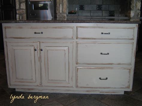 Lynda Bergman Decorative Artisan White Kitchen Cabinets To A Hand