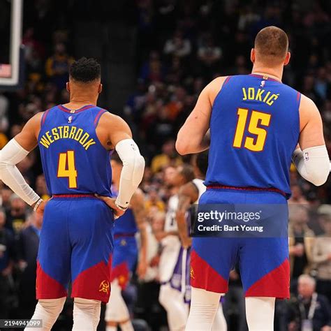 Russell Westbrook and Nikola Jokic of the Denver Nuggets looks on