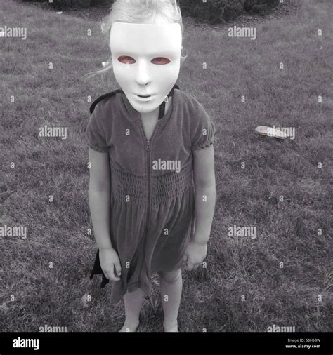 Girl wearing Halloween mask Stock Photo - Alamy