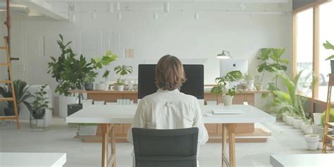 Premium Photo | Person Working at Desk in Office