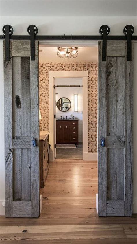 An Open Door Leading To A Bathroom With Wood Floors