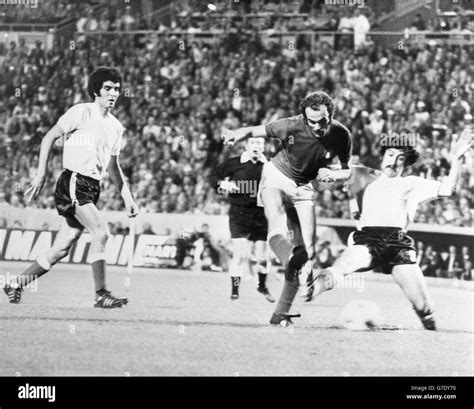 Italy's Sandro Mazzola squeezes past Argentina defenders Roberto Telch (left) and Ruben Oscar ...