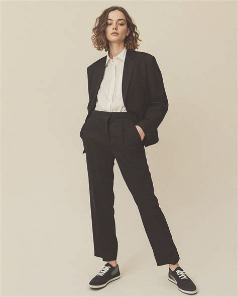 Black Tailored Suit with White Shirt and Trainers