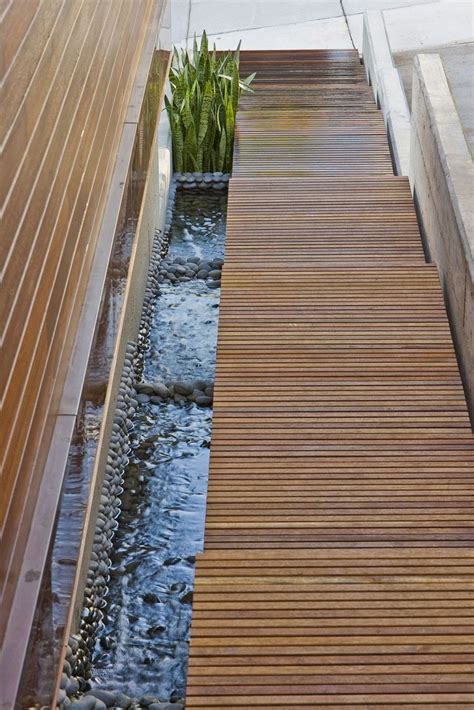 Love The Natural Details Wood Stair Case With Rock Waterfall Modern