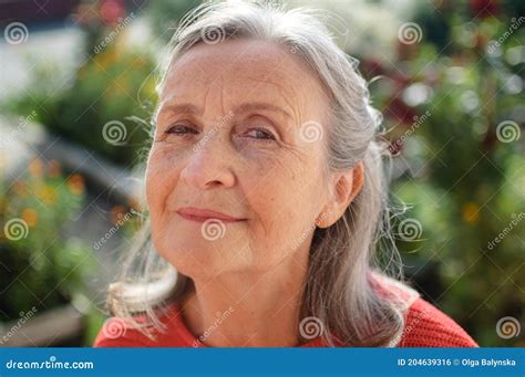 Beautiful Old Grandmother With Grey Hair And Face With Wrinkles