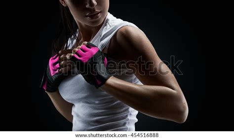 Close Up Portrait Of Female Bodybuilder Wearing Gloves Ready For Gym