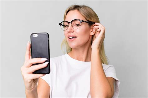 Premium Photo Pretty Caucasian Blonde Woman Using Her Smartphone