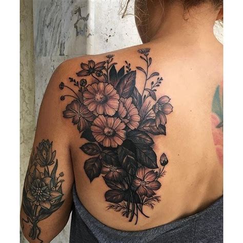 A Woman S Back With Flowers On It