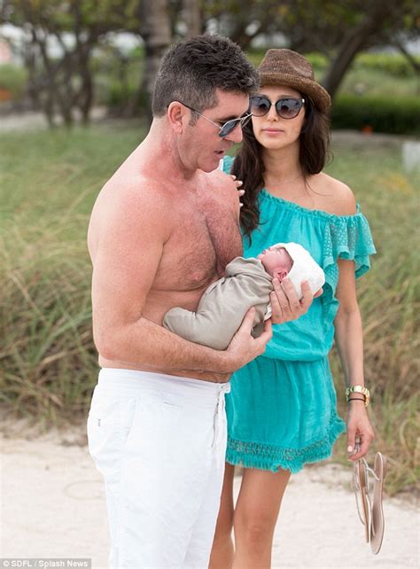 Simon Cowell Gingerly Adjusts His Shirt As Sunburnt Star Goes For Meal