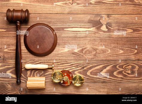 Judges Gavel Stamps And Scales Of Justice On Wooden Background Stock