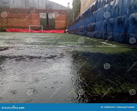 Football in the rain stock image. Image of cold, football - 152865245