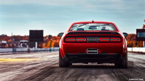 Download Dodge Challenger In Racing Track Wallpaper