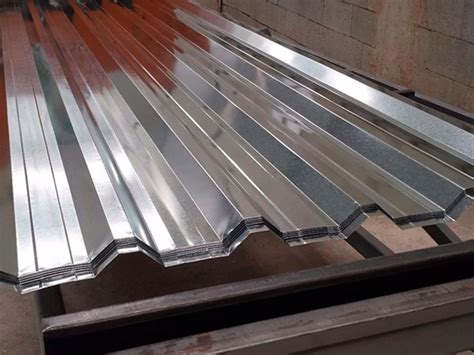 Metal Roofing Sheets Are Stacked On Top Of Each Other