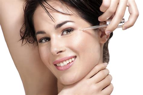 Beautiful Model Applying A Skin Serum Treatment Stock Photo Image Of