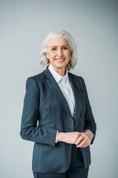 Senior Businesswoman In Suit — Stock Photo © Igortishenko 153609936