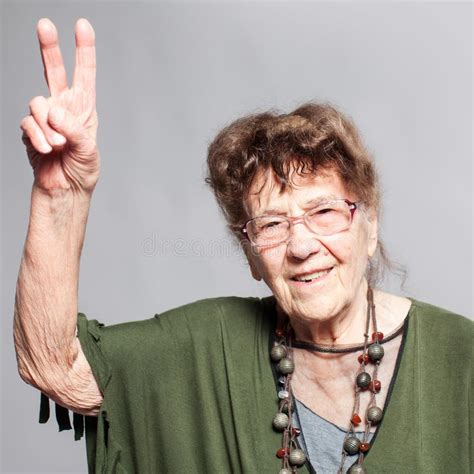 Old Granny Exercising At Outdoors Gym Playground Equipment Stock Image